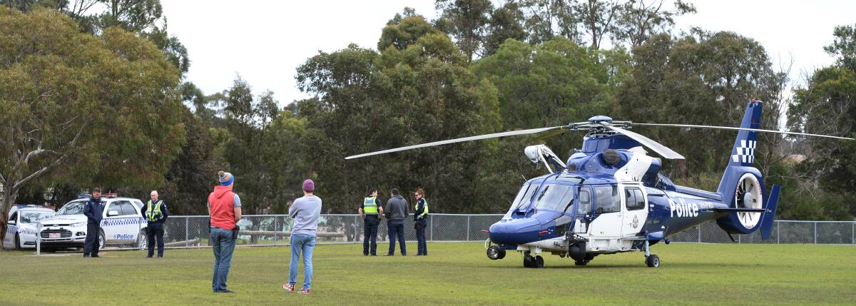 SHOW OF FORCE: A police helicopter lands at Mount Clear back in 2014. The roll out of a new fleet will begin in 2019 after the start of a tender process was announced by Police Minister Lisa Neville this week. Picture: Kate Healy