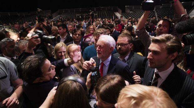 Jeremy Corbyn surrounded by members of the media at an event to announce the results of the Labour leadership contest. Photo: Bloomberg