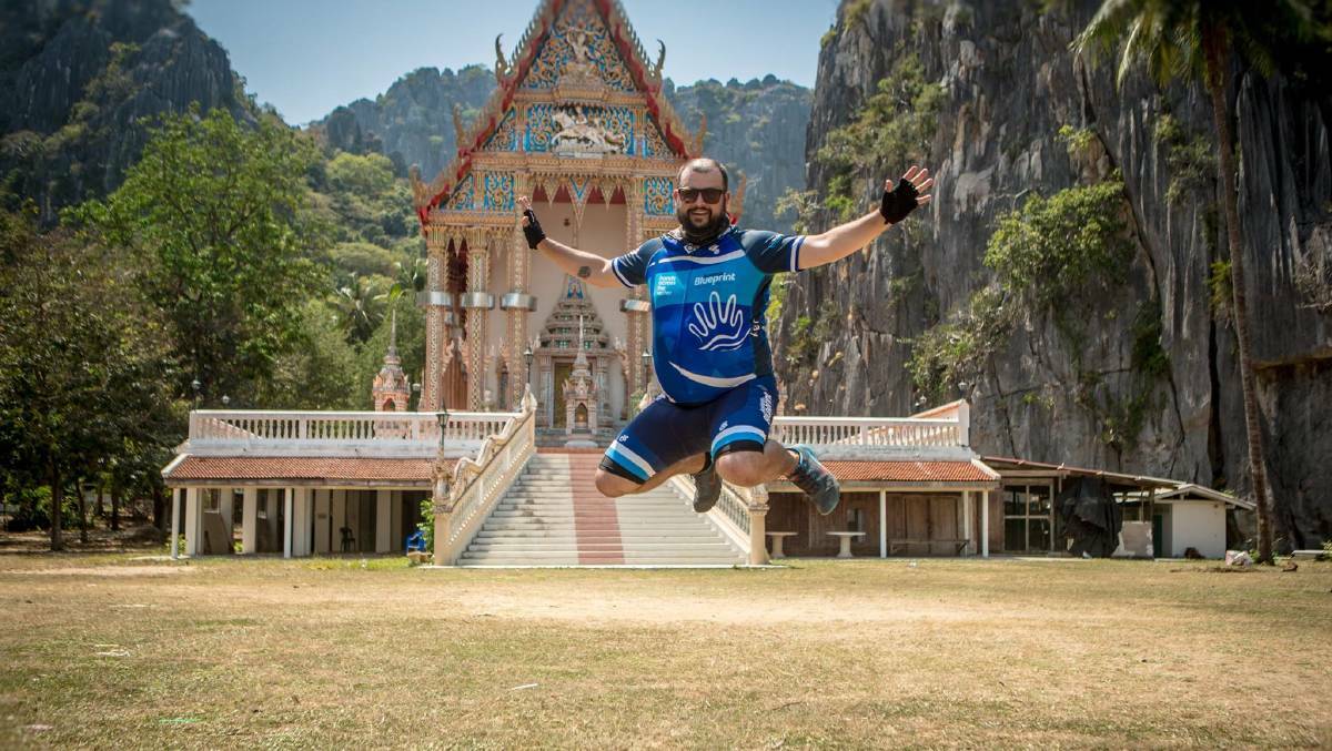 Jumping for joy: Jay Beaumont will make his fourth trip to Thailand this month for charity. He is shown here in front of a temple in 2016.