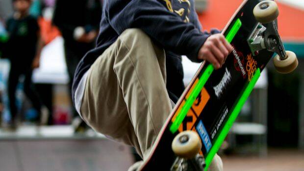 How do you park a skateboard? New road rules require it before using a mobile phone.  Photo: Georgia Matts