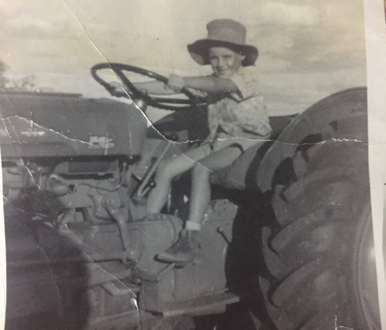 WHO IS ROBERT: Can you help solve the mystery of this photo, which has "Robert driving tractor" written on the back?

