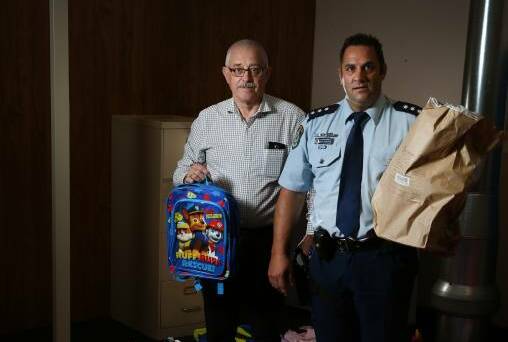 Best and Less loss prevention manager Graham Wilson and Central Hunter Acting Inspector Mitch Dubojski with the seized items. Picture: Marina Neil
