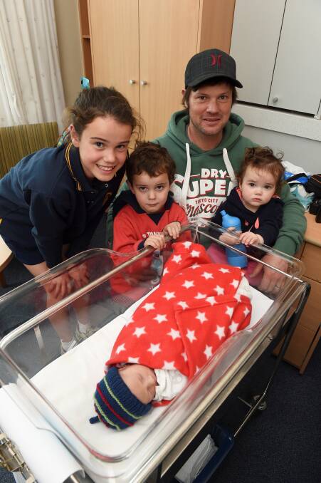 Spring delight: Lulu, 11, Alfie, four, dad Luke and 16-month-old Betsy Riches have welcomed newborn Sid into their family at the Ballarat Base Hospital. Picture: Lachlan Bence