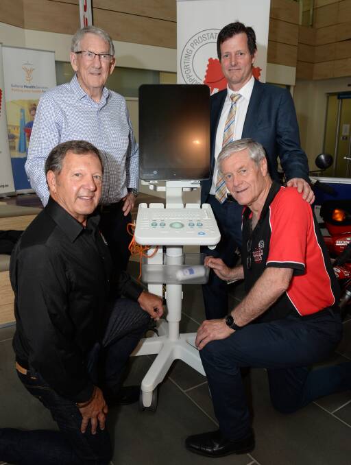NEW: Male Bag's Robert Glover, businessman Peter Stevens, urologist Lachlan Dodds and Male Bag patron David Parkin with the prostate biopsy machine. Picture: Kate Healy