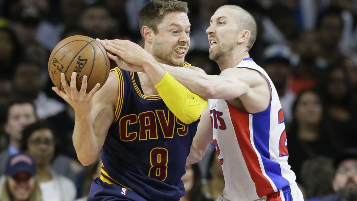 Detroit Pistons guard Steve Blake (22) reaches in on Cleveland Cavaliers guard Matthew Dellavedova (8) during the second half in Game 4 of a first-round NBA basketball playoff. Picture: Associated Press.