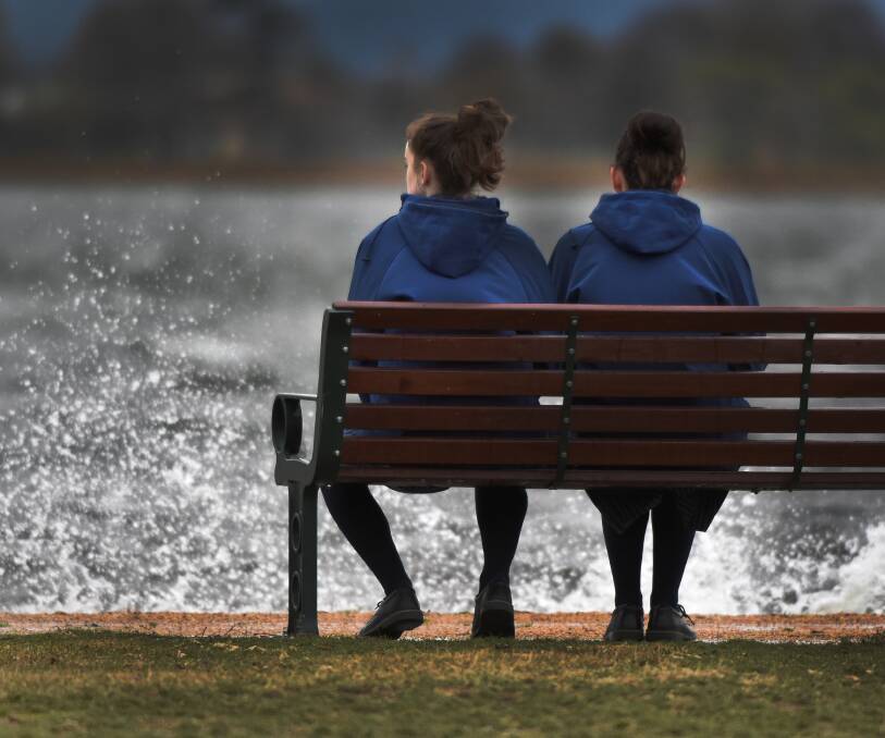 COLD BURST: Lake-goers wait out the final days of a Ballarat winter, which has been the city's wettest in four years. Picture: Lachlan Bence