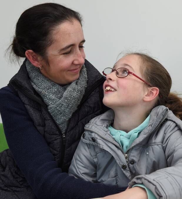 SUPPORT: Christine Henderson with 10-year-old Lorelai, who says her diabetes has not stopped her playing or eating the same as other children. Picture: Lachlan Bence