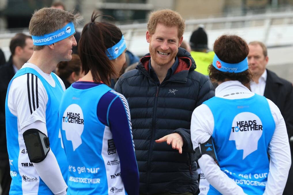 SETTING THE TONE: Prince Harry chats with runners this week amid their preparations for the London Marathon, an important step in promoting mental fitness. Picture: Getty Images