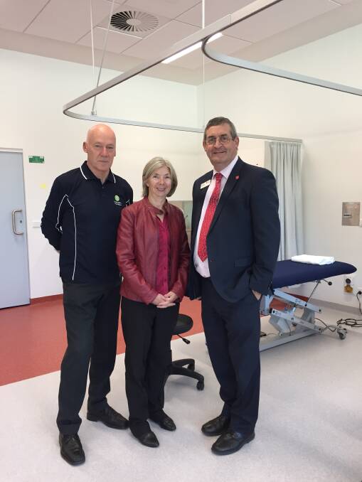 BIG MOVE: Physiotherapist Charles Flynn, ACU national head of school of physiotherapy Suzanne Kuys, Aquinas campus dean Joe Fleming in the new classrooms.