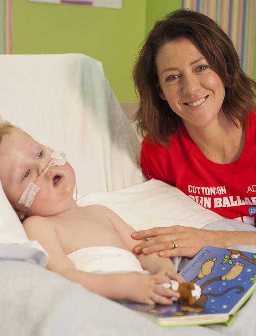 SPECIAL CARE: Run Ballarat ambassador Gorgi Coghlan meets two-year-old Nate Primmer, who has Pompe disease, in the BHS Base Hospital children's ward.