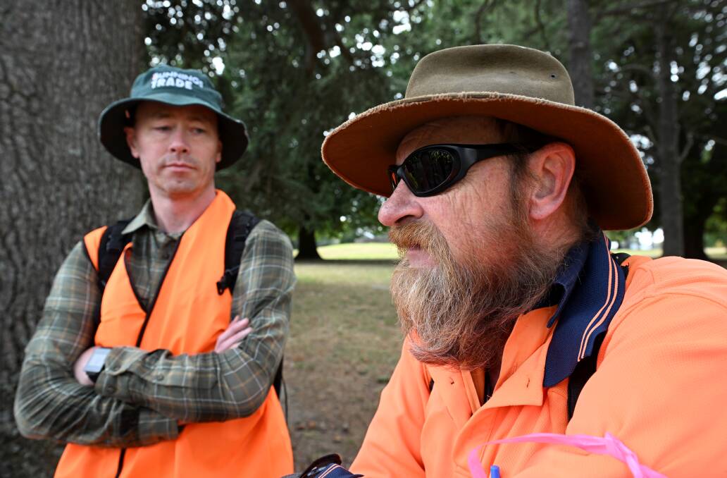 Melbourne-based dad Simon Tong, who grew up in Ballarat, and defence force veteran David Tong prepare to set out on the search in hi-vis clothing. Picture by Lachlan Bence