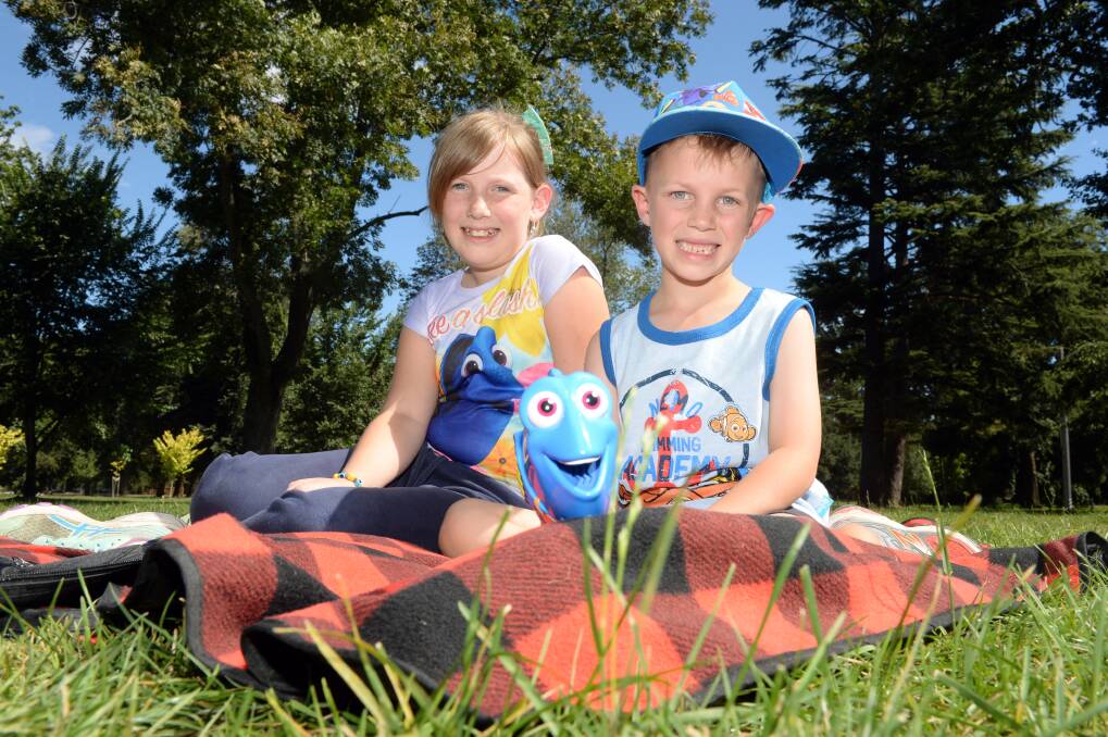 MISSION: Scarletta, 10, and Bowie, 7, have staked their spot lakeside for 'Finding Dory', screening in the Reach4Research twilight cinema. Picture: Kate Healy