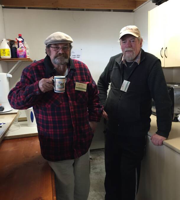 CRAMPED: Sebastopol Men's Shed committee member Mick Minter catches up with shed president Les Shimmin in the existing tiny kitchen for 70 members. 