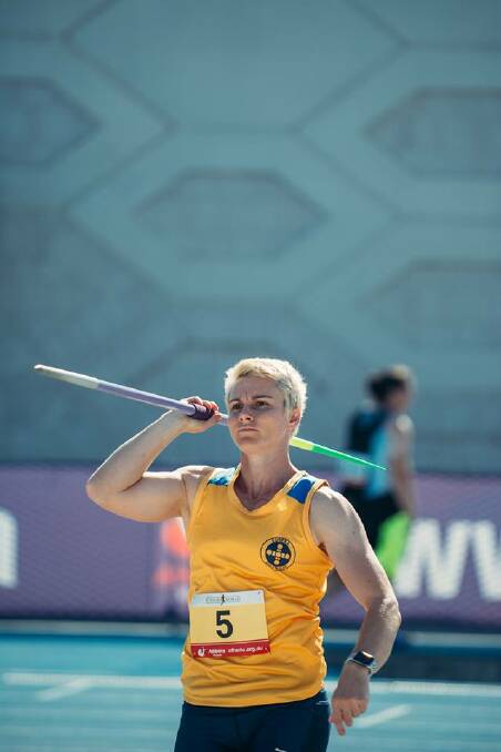 PERSPECTIVE: Kathryn Mitchell proudly steps out in Eureka colours to throw her way into the history books with her sharper game at Melbourne's Lakeside Stadium last weekend. Picture: Athletics Victoria