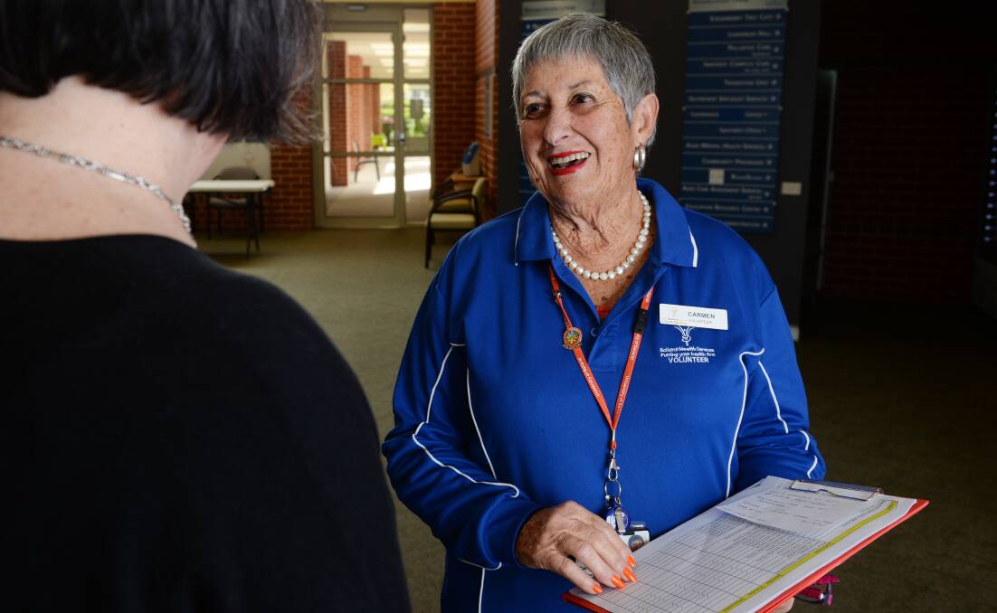 WARM GESTURE: Ballarat Health Services' volunteer Carmen Simkin has a new Welcome Team post at the Queen Elizabeth Centre from this week. Picture: Kate Healy