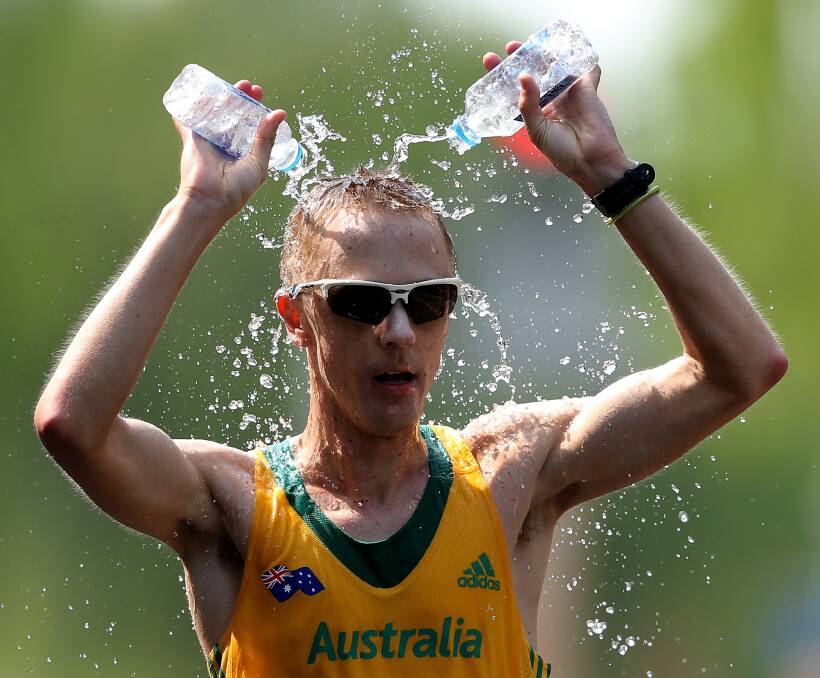 REFRESHING: Jared Tallent cools off after capturing world championship in Beijing last weekend. He says it is the first "clean" 50km he has raced in a major meet for a long time. Picture: Getty Images