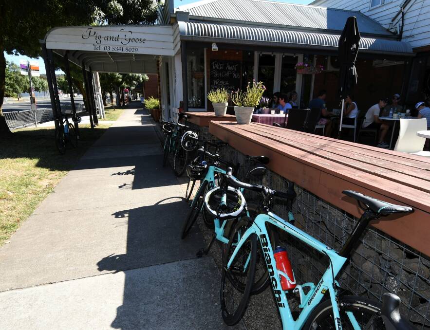 PARKED: Traders say cyclists are lingering longer between racing and training this year. Pictures: Lachlan Bence