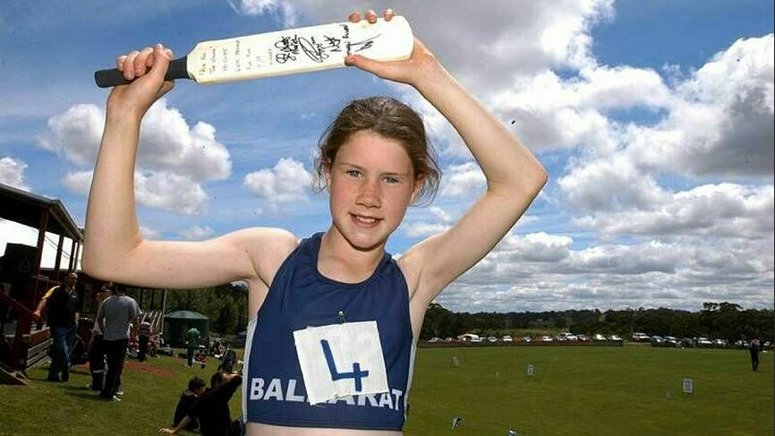 An 11-year-old Katelyn Jones claims her batting prize after finishing first in the under-17 sprint in 2005. Picture by Eugene Hyland