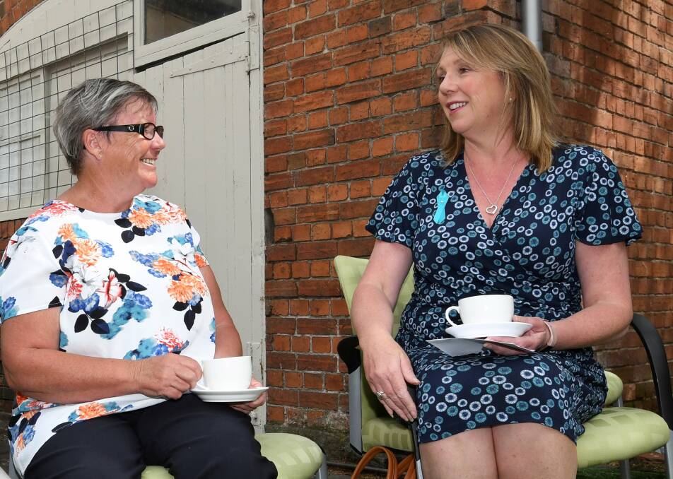 CRUCIAL: Tricia Bromley and Catherine King talk over a cuppa for a Morning Teal to support survivors, family and to promote awareness. Picture: Lachlan Bence