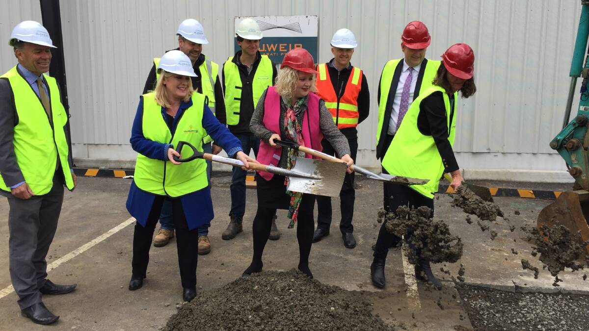 WORKS UNDERWAY: Victorian Health Minister Jill Hennessy, flanked by Wendouree MP Sharon Knight and Ballarat Health Services chairman Rowena Coutts, turns the first sod on BHS' new cath lab on Monday morning.