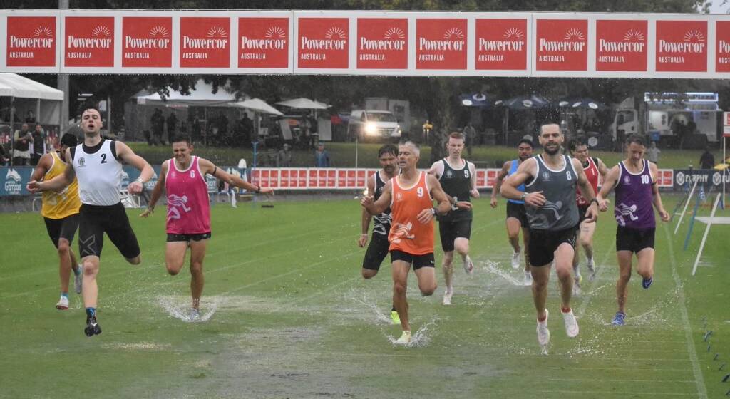 Talking bravery, Rory Nunn (in the grey singlet), claims his first Stawell Gift sash almost 10 years in the making on a sodden Central Park track. 