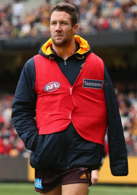 NOT SO BAD: James Frawley may look a solemn figure in the red subs vest on Saturday but scans have revealed he does not need shoulder surgery. Picture: Getty Images.