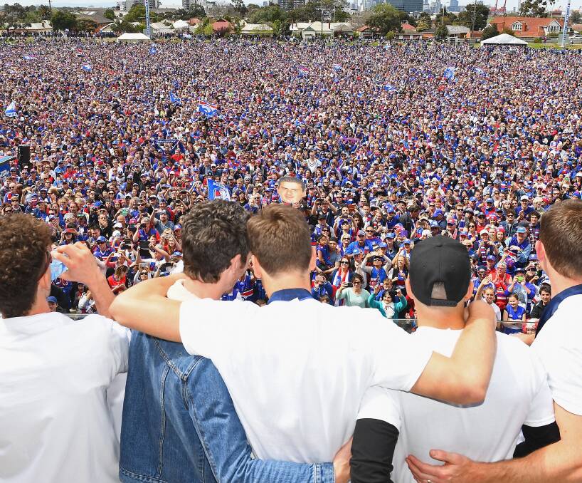 MISSING: Seeing Luke Beveridge with the cup in Ballarat was awesome but, organised or not, we missed these guys for our block party. Whitten Oval is their home, but Ballarat is now, too. Picture: Getty Images.