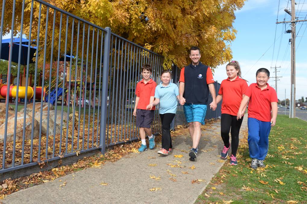 ON THE MOVE: Forest Street primary pupils step out for Walk to School Day last May. Australian health experts say walking to school everyday can set good habits for life.