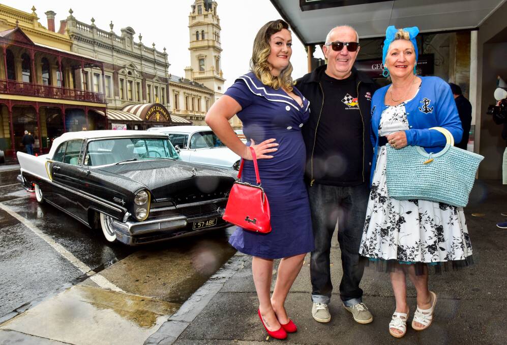 Lisa, Darryl and Kay Thompson with his 1963 Falcon Coupe in Lydiard Street. Picture: Brendan McCarthy