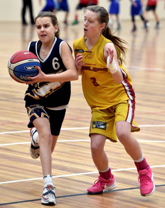DANGER ZONE: Ballarat's Alana Bodey takes on Amelia Goodman, whose club Western Port travelled from near the Mornington Peninsula to contest the tournament last year.