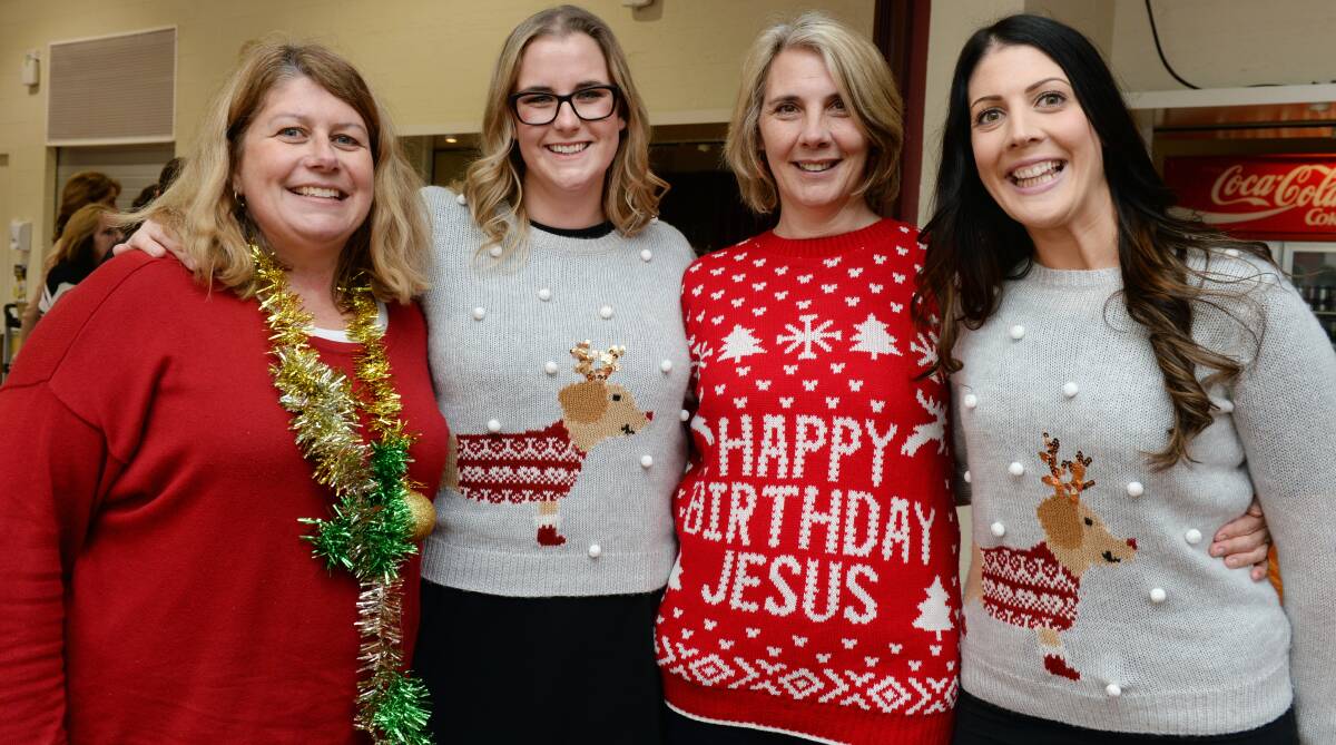 JOYFUL: Allison Boucher, Kaitlin Taylor, Annette Riddell and Rebekah Robertson get festive for FedUni's Christmas in July charity lunch. Picture: Kate Healy
