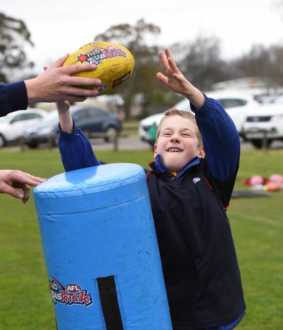 ACTION: Ten-year-old Mitchell Rehfisch tries out his skills in Ballarat's all-abilities Auskick. Organisers hope it could help build a future path for players to Ballarat Bulldogs' all-abilities football team. Picture: Kate Healy