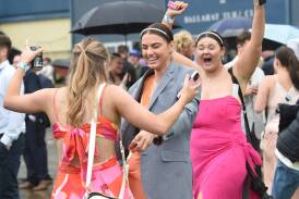 Ballarat Tahlia Kirby, Sophie Warke and Em Zammit enjoy the winning feeling at the Cup last weekend. Picture by Kate Healy
