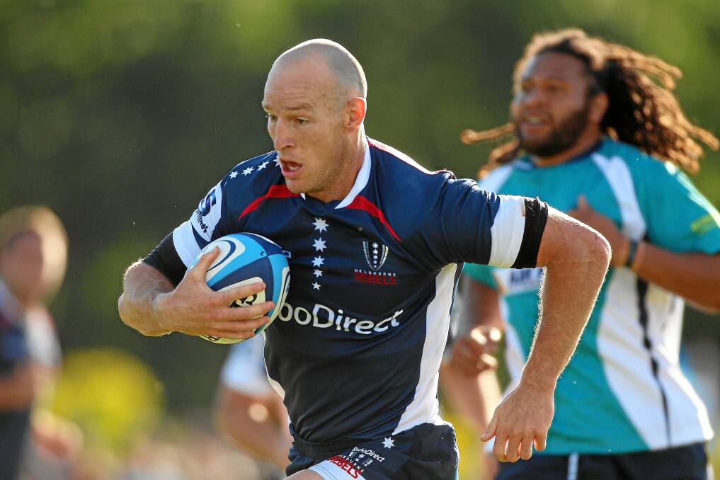 EXAMPLE: Melbourne Rebels star Stirling Mortlock runs in to score a try during a Super Rugby trial match against Fiji at St Patrick's College in 2011.