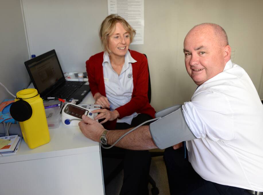 ROLE MODEL: Ballarat mayor Des Hudson rolls up his sleeves for BCH lifestyle leader Louise Feery to test his ticker and set an example for his city. Picture: Kate Healy