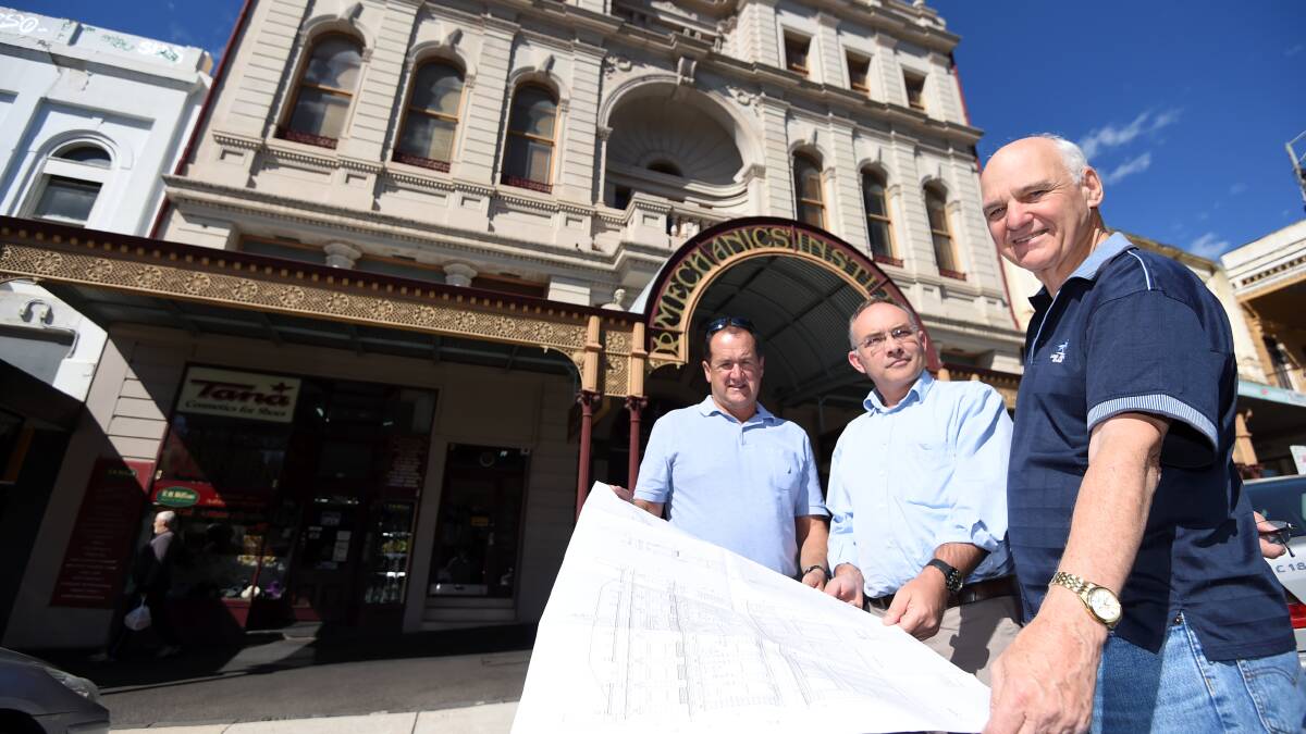 APPROVED: Ballaarat Mechanics' Institute president Graham Gooding is impressed with plans to restore the building front, led by Nicholson Construction director and Quadratum heritage architect Fraser Brown. Picture: Lachlan Bence