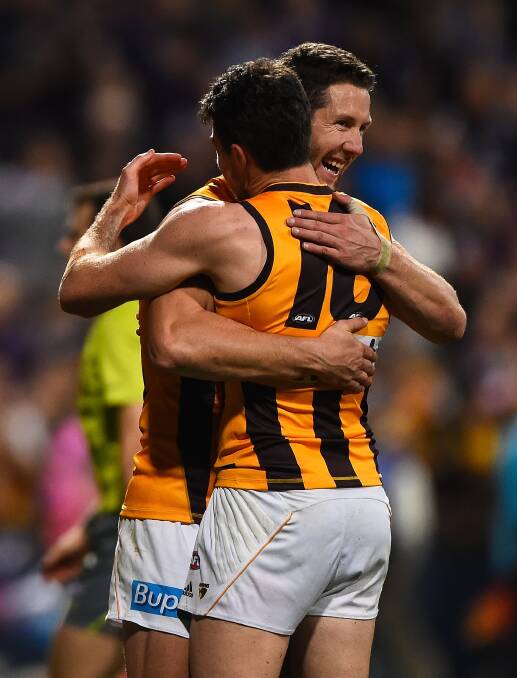 Isaac Smith and James Frawley celebrate the hawks' preliminary final win against Fremantle on Friday night. Picture: Getty Images