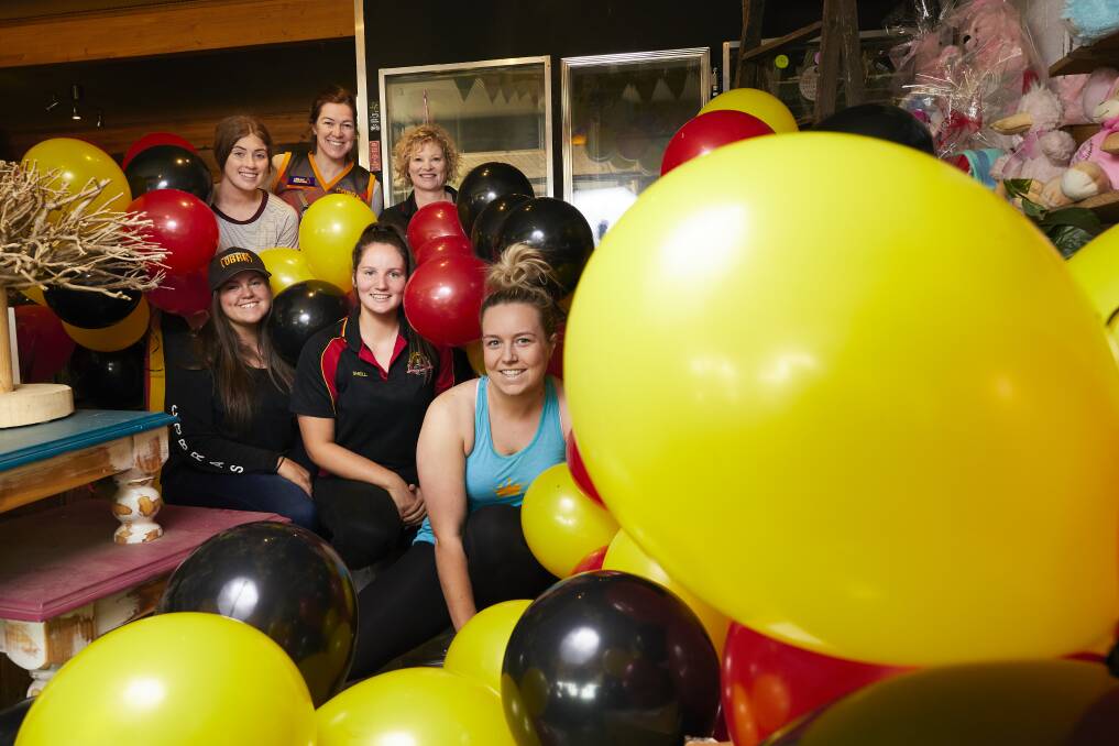 PREPARATION: Cobras netballers and supporters prepare to decorate southside in Bacchus Marsh colours.