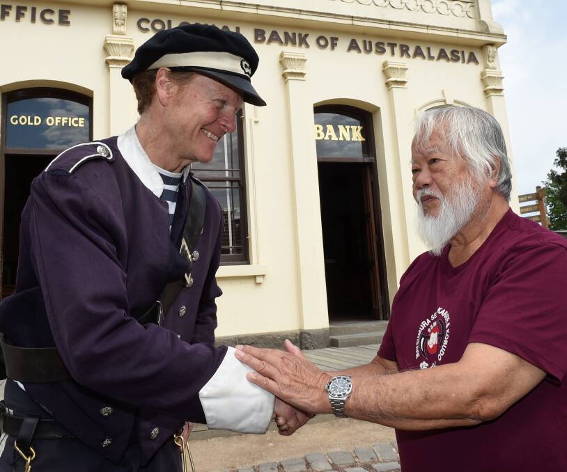 TOP PRIORITY: Sovereign Hill trooper Mick Durham meets Japanese karate Grand Master Kise Fusei, who was keen to return to Main Street. Picture: Lachlan Bence