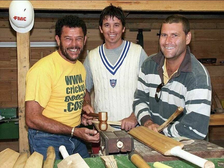 Former Australian Test cricketers Mike Whitney, Gavin Robertson and Phil Emery knock in a bat in the bat making workshop at Cricket Willow Shepherd's Flat as part of centenary celebrations in 2002.