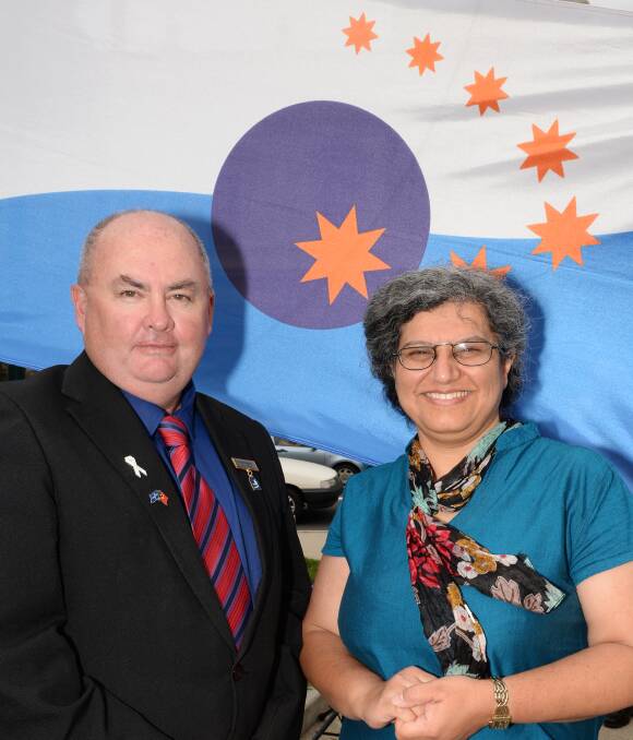 UNITED: Ballarat mayor Des Hudson and Ballarat Interfaith Network chairman Elham Jamali promote community harmony in the annual flag-raising ceremony. Picture: Kate Healy