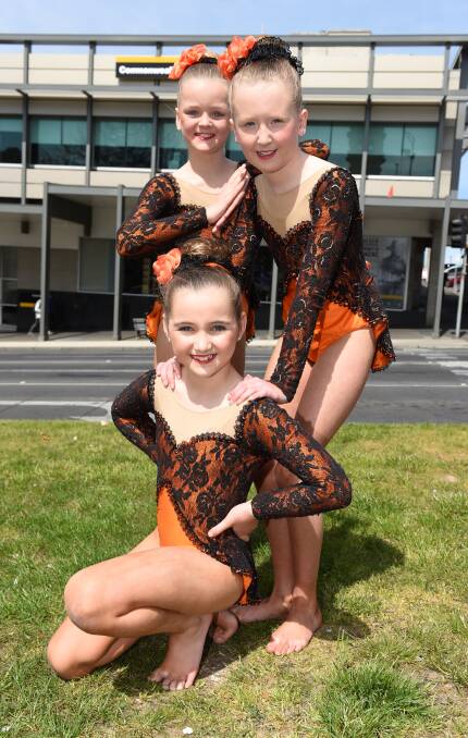 SHINE: Jayde Calisthenics sub-juniors performers Phoebe Forbes, Libby Cook and Eva Gallagher are ready for Royal South Street. Picture: Lachlan Bence