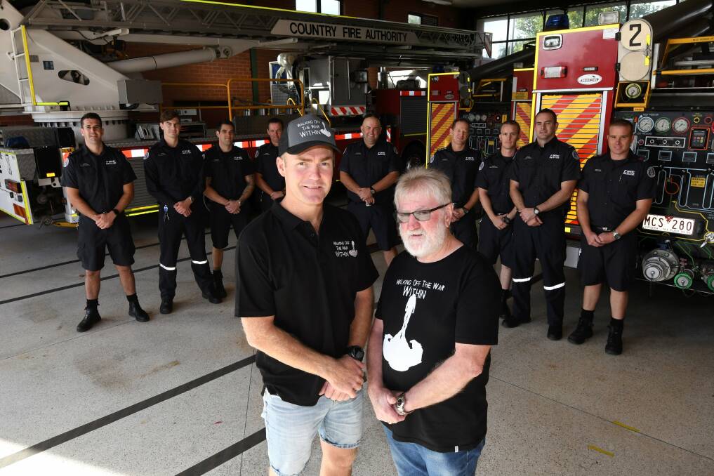 UNITED: Firefighter Josh Martin, mental health advocate John Shanahan and Ballarat City Fire Brigade's C-shift. Picture: Lachlan Bence