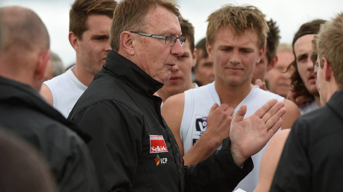 Roosters coach Gerard FitzGerald addresses players in Saturday's win against Sandringham in Ballarat.