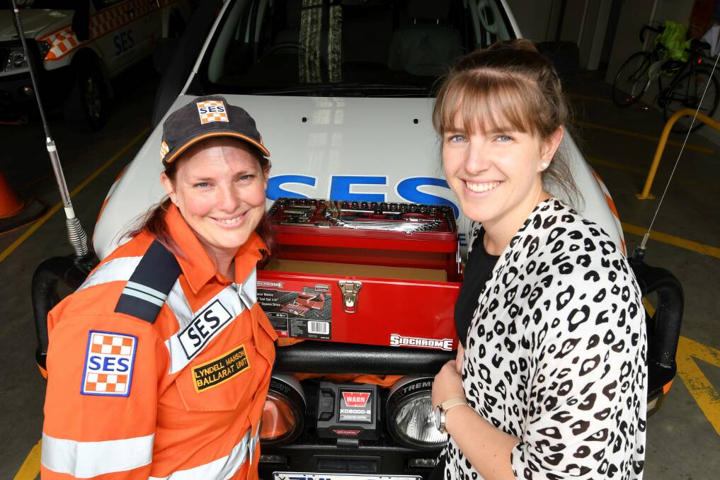 TEAM WORK: Berry Street worker Emily delivers a handy toolbox to SES Ballarat deputy controller Lyndell Manson ahead of the holidays, which can be the toughest time of the year for both agencies. Picture: Lachlan Bence