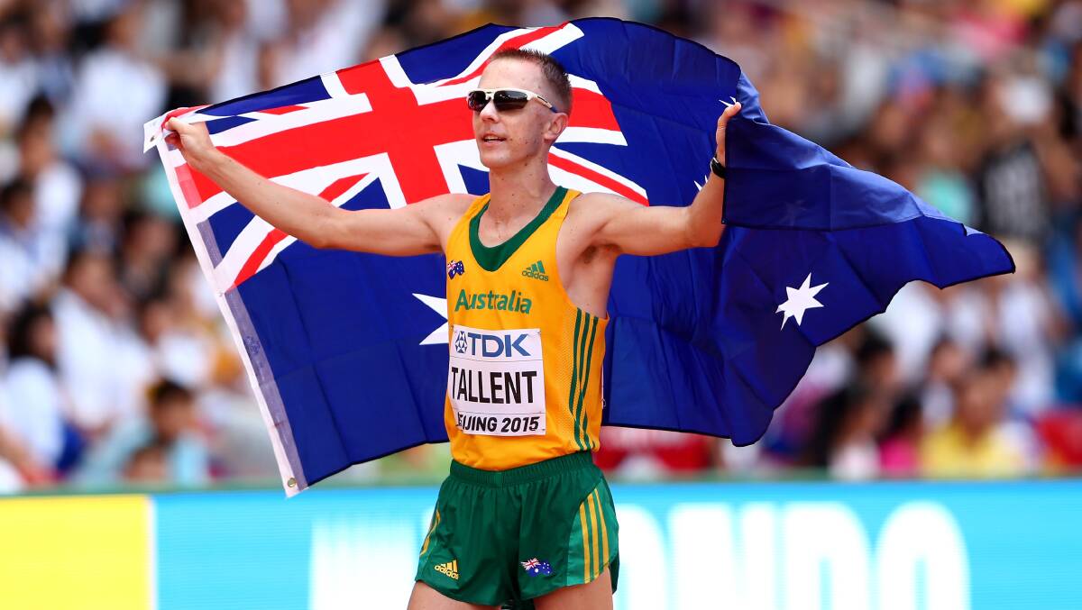 Ballarat's Jared Tallent celebrates after crossing the line to win world championship silver in the men's 50km walk in Beijing. Picture: Getty Images