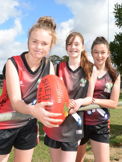 MOTIVATED: Mount Clear College footballers Lily Jones, Kyla Thompson and Poppy Ball (year nine) are inspired by the girls who played before them. Picture: Kate Healy