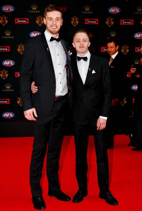SUPPORT: Jordan Roughead takes Ladder success story Darcy on the red carpet in their new suits for Brownlow night. Picture: courtesy of Ladder