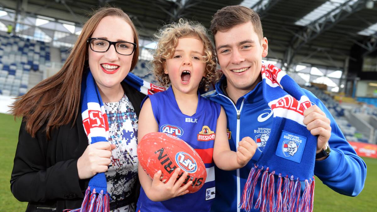 IMPACT: Five-year-old Charlie unleashes his roar with Ballarat councillor Amy Johnson and Western Bulldogs premiership player Josh Dunkley at Eureka Stadium on Friday. Picture: Kate Healy