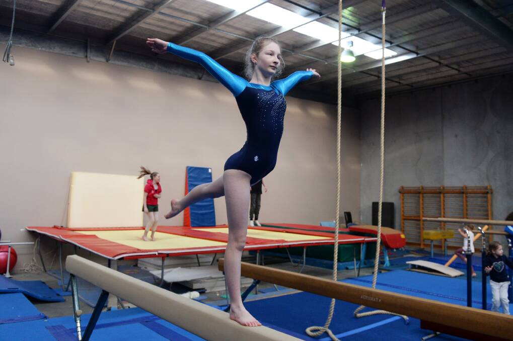 ON SHOW: Barwon Special Olympics gymnast Lauren Menzies performs on the bar in Ballarat to inspire more gymnasts for the new all-abilities program. Picture: Kate Healy